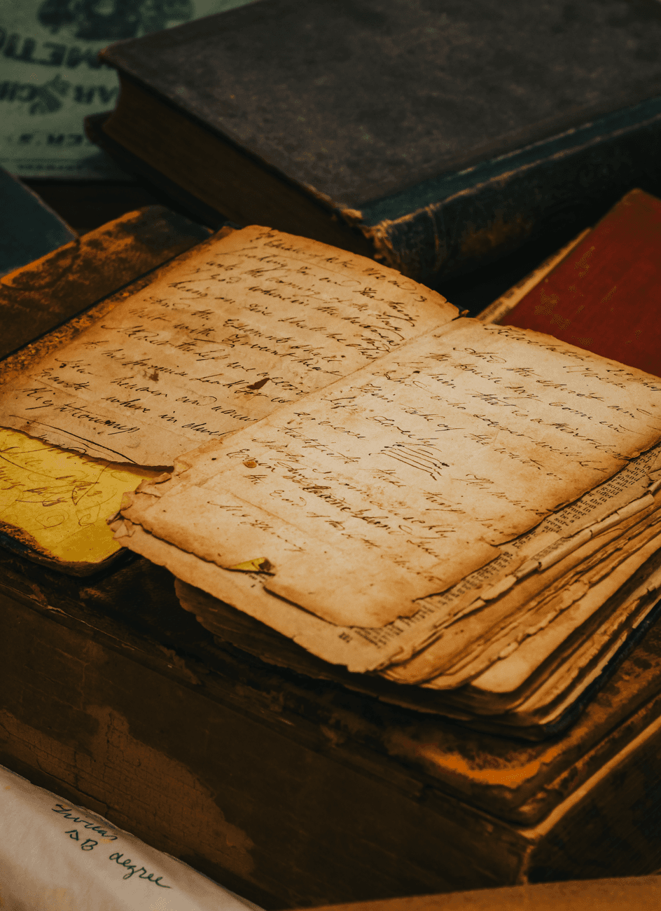Old paper with cursive writing on a vintage desk, capturing a timeless historical essence.